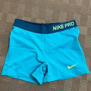 Teal woman’s Nike Pro shorts